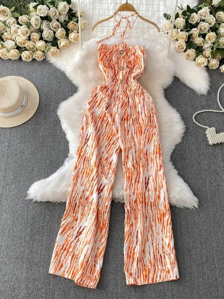 夏のセクシーなジャンプスーツ女性プリント胸ラップぶら下げネックストリートジャンプスーツ女性ストレートレッグワイドレッグパンツロンパース