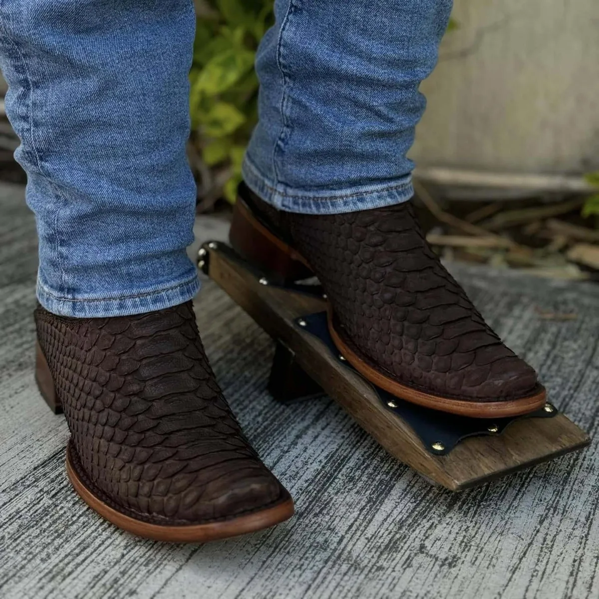 Cowboy boots with thick heels, crocodile square toe, and python pattern mid-calf western boots.