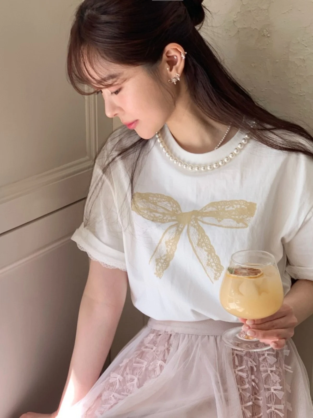 T-shirt da donna estiva nuova con stampa nodo in pizzo ort Sve Pearl round Ne Loose Top coreano Sle Pendolarismo Faion