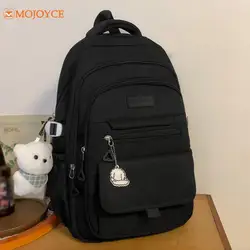 Mochilas escolares de grande capacidade para meninas adolescentes, mochilas estudantis com pingente, mochila casual sólida, mochila de viagem leve de nylon