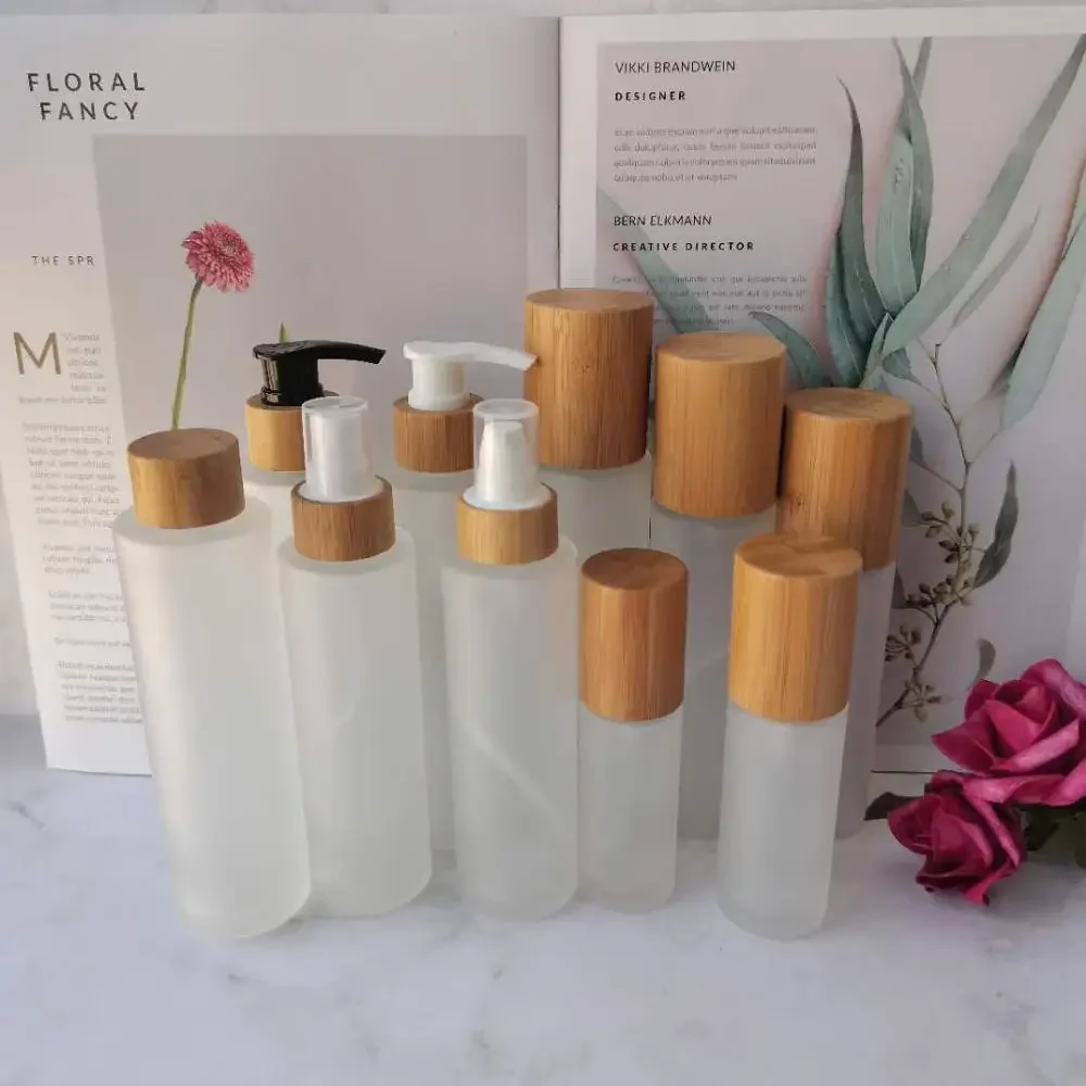 

High Quality falt shoulder Frosted Boston Round Glass Cosmetic Bamboo Cap Bottle Skincare Toner Bottles Packaging container