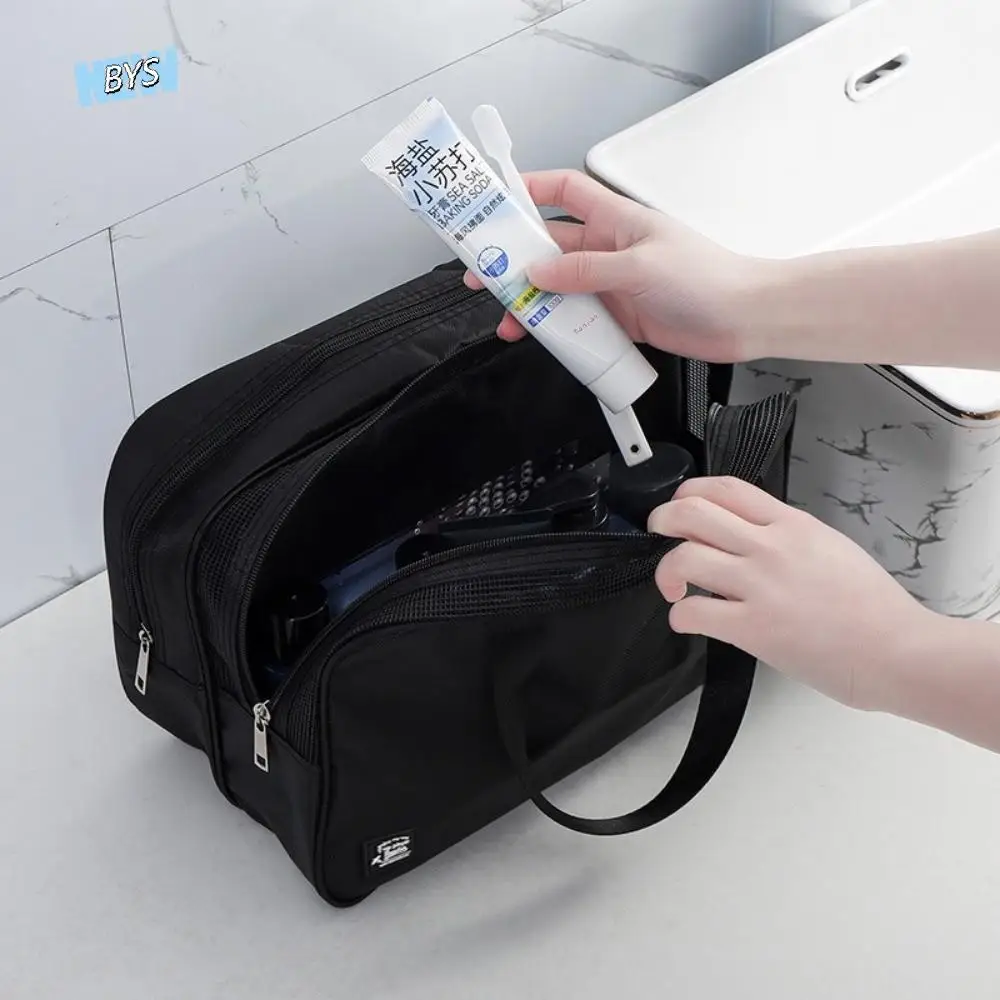 حقيبة مستحضرات التجميل المحمولة بلون سادة من قماش أكسفورد حقيبة أدوات الزينة المحمولة السميكة ذات سعة كبيرة على الطراز الكوري حقيبة مكياج #1