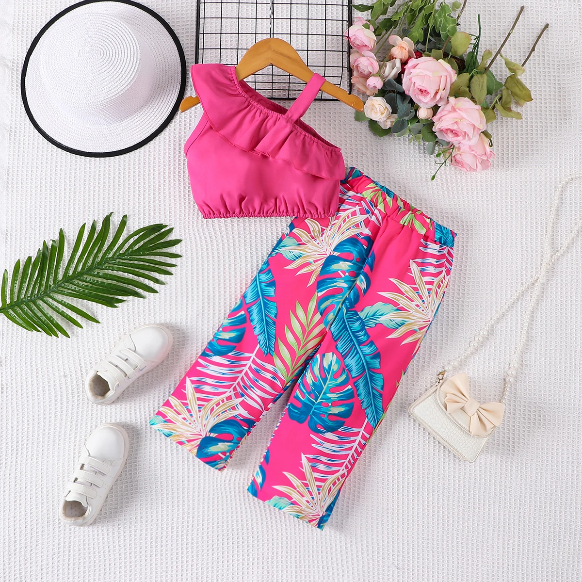 Two piece summer girl fashion vacation style suspender sloping shoulder top and floral full print pants set