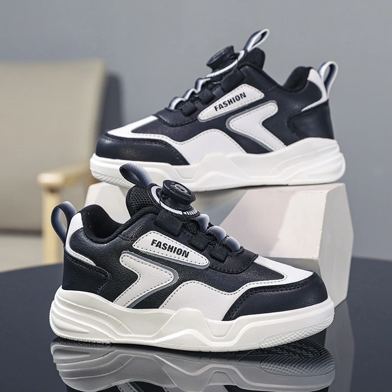 A pair of children's color block rotary thick sole leather sneakers easy clean for school outdoor daily casual shoes XJY-5188