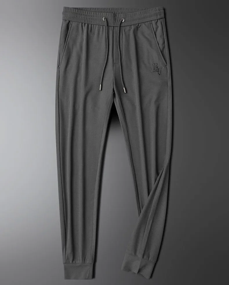 Pantaloni casual da uomo con ricamo a farfalla di marca di fascia alta primavera/estate nuovi pantaloni sportivi in seta di ghiaccio comodi e