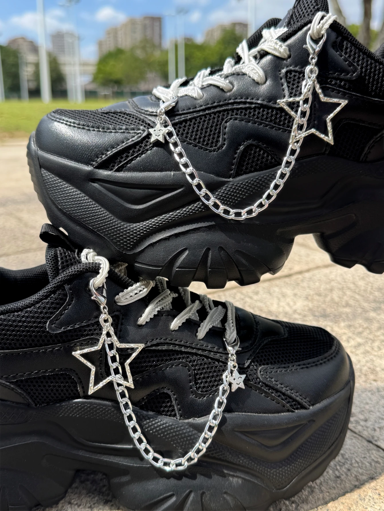 Two star-shaped shoe accessories with detachable decorative chains for DIY shoe and boot decorations, suitable for sneakers, ca
