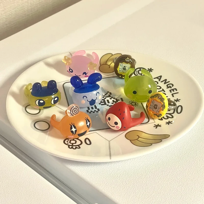 Nuevo en Stock Bandai Tamagotchi anillo decorativo de cabeza grande dijes anillo transparente modelo de mascota colgantes regalos personajes de estilo