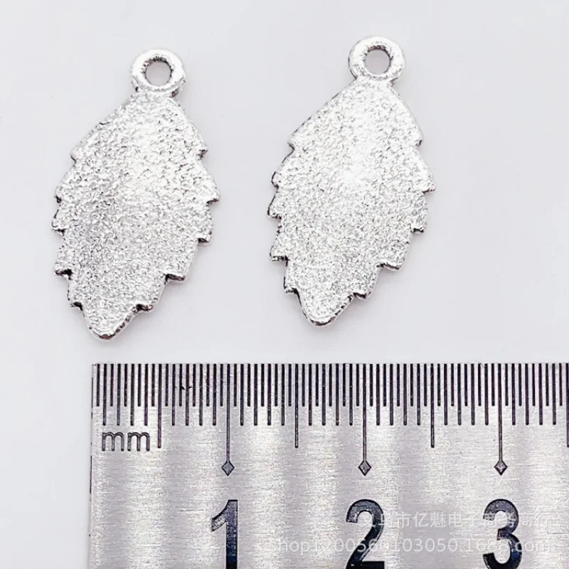 Factory Direct Sales 100Pieces DIYZinc Ornament Plant Leaves Feather Pendant 23*12MM Clothing Bags and Gifts