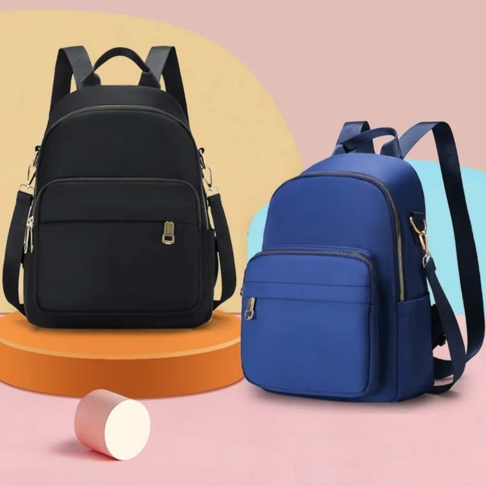 حقيبة ظهر مدرسية محمولة من النايلون بسعة كبيرة بلون سادة حقيبة كتف كاجوال متعددة الوظائف للنساء
