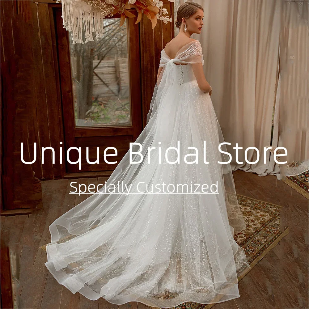 Abiti da sposa sexy personalizzati con spalle scoperte Elegante gonna divisa a trapezio aperta sul retro Bellissimo abito da sposa dal design applicato