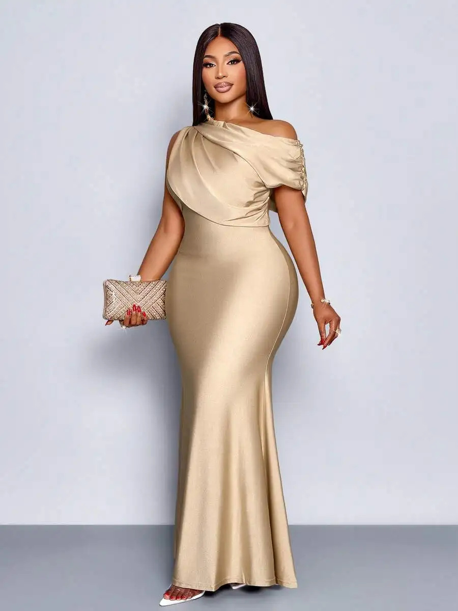 

Champagne Off-Shoulder Asymmetrical Maxi Dress with Pleated Front, Fish Tail Hem, Knitted Shimmer Fabric