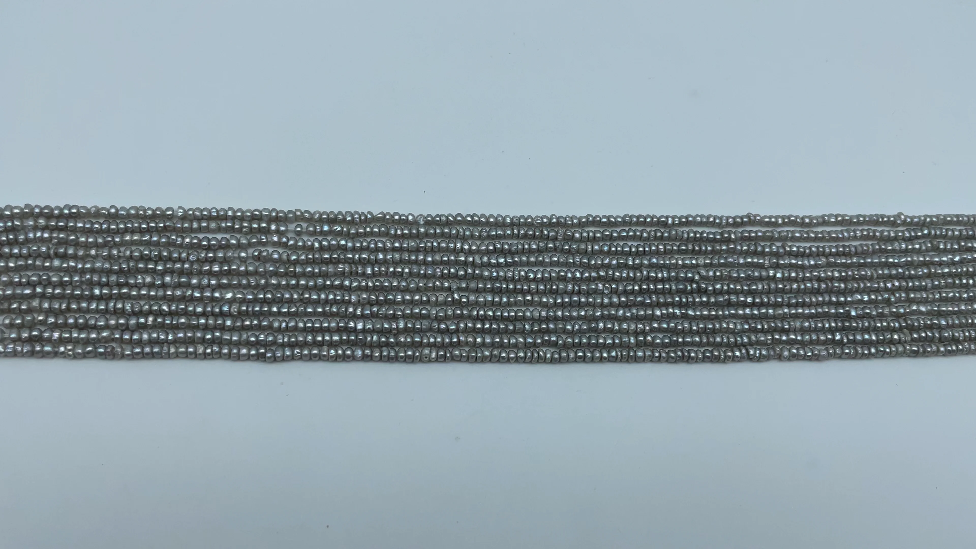 

Wholesale 2.5-3mm Natural Gray Pearl Button Freshwater Strands