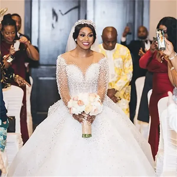 Vestidos de novia de talla grande de princesa personalizados ilusión manga larga llenas de perlas apliques de encaje hinchados boda real africana