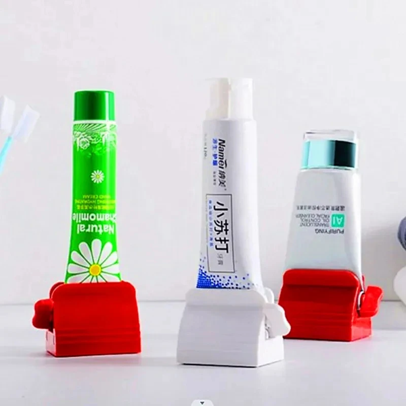 Distributeurs de dentifrice, rouleaux à dentifrice, supports à dentifrice, gadgets de salle de bain et de cuisine adaptés à divers cosmétiques tubulaires