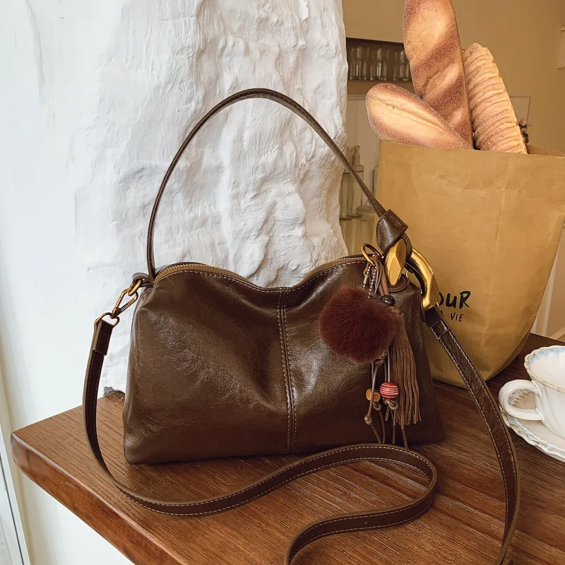 

Женская винтажная минималистичная сумка через плечо 2025 года, многосторонняя сумка через плечо из натуральной кожи нишевого дизайна, маленькая сумка в стиле ретро