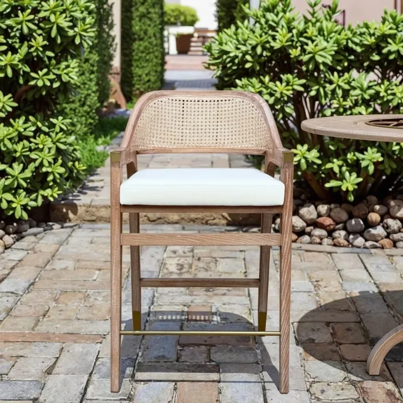 Light wood rattan high-backed solid wood bar stool with linen cushion - high lounge chair for restaurants and bars