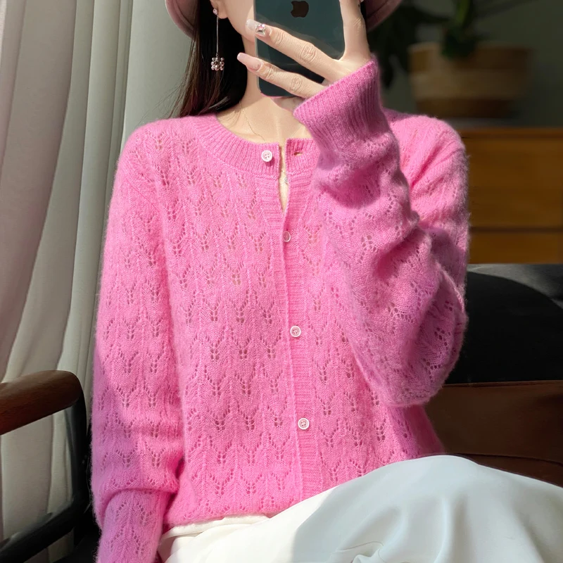 Autumn and winter new 100% pure wool cardigan female O-neck hollow crocheted solid color long sleeve sweater loose sweater coat.