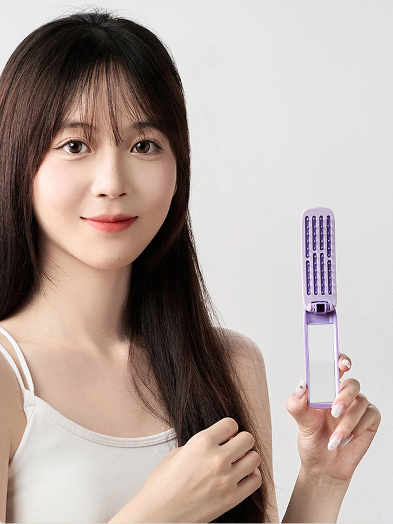 مشط محمول 2 في 1 قابل للطي مع مرآة لتدليك فروة الرأس ومشط وسادة هوائية للسفر مناسب لجميع أنواع الشعر