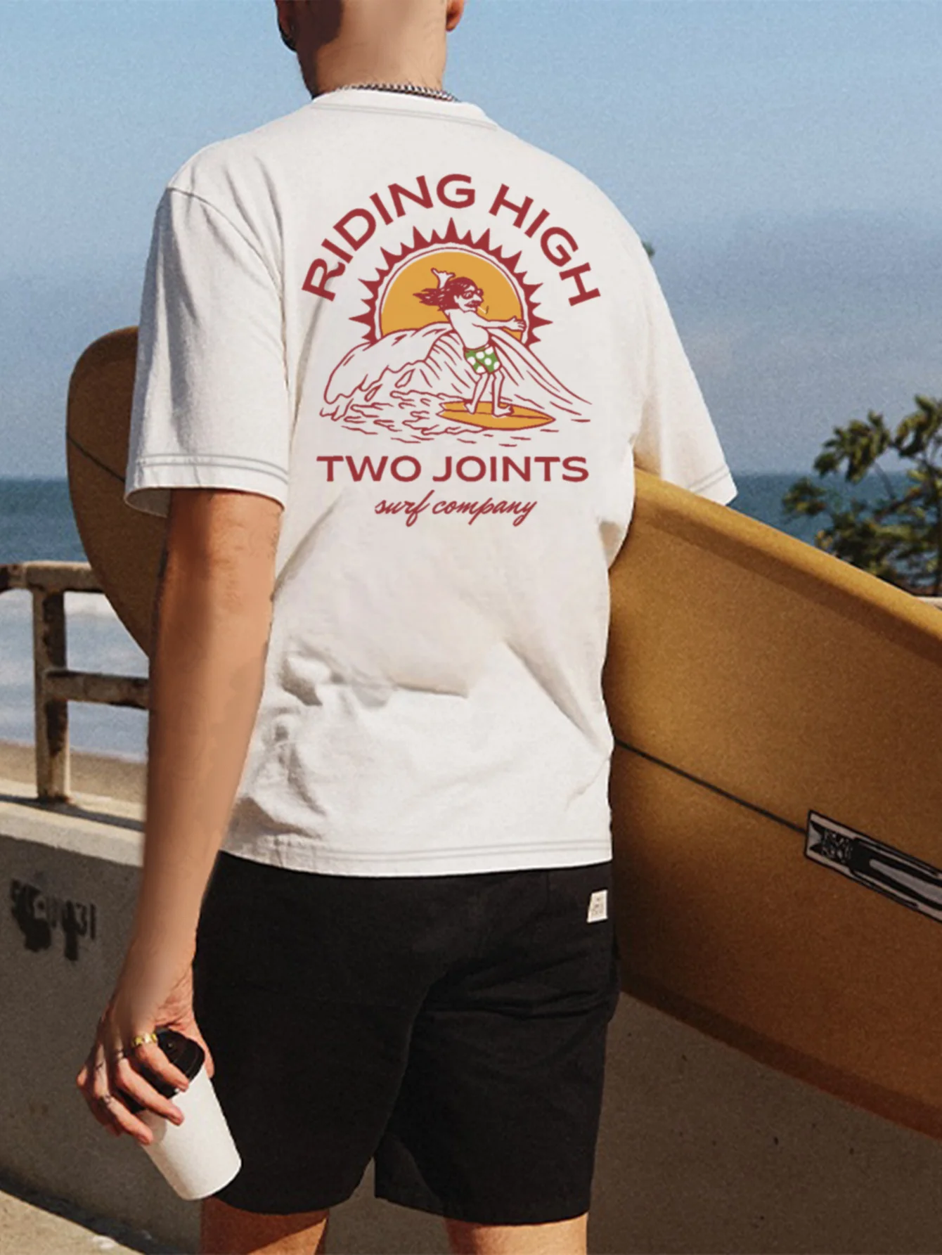 Short-sleeved T-shirt -100% cotton, geometric surfing and sunshine design, printed by riding high two joints company.