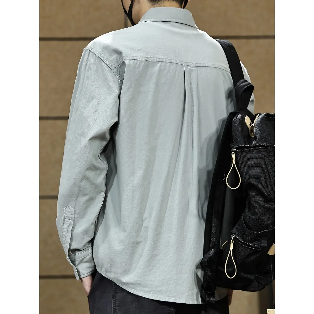 เสื้อเชิ้ตแขนยาวสีพื้นสไตล์อเมริกันระดับไฮเอนด์สำหรับผู้ชาย ฤดูใบไม้ผลิและฤดูใบไม้ร่วงใหม่ เสื้อแจ็คเก็ตเชิ้ตแบบลำลองเรียบง่ายสำหรับผู้ชาย