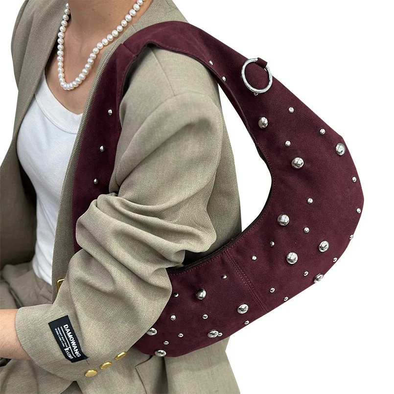 

2025 new minimalist and retro shoulder bag with rivets for women featuring unique frosted underarm bag