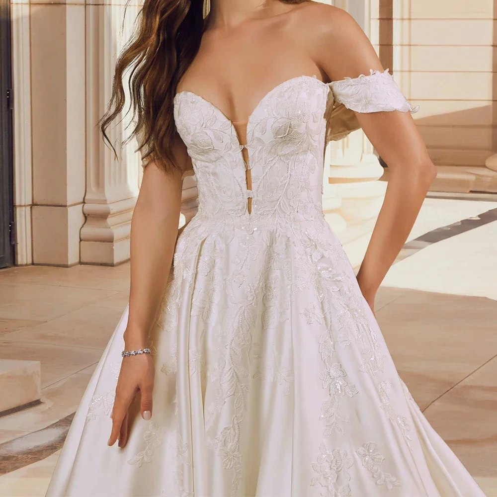 ロマンチックな A ラインのウェディングドレス大きく開いた恋人ネックアップリケカスタマイズされたブライダル成長オフショルダースリーブ Vestidos De Novia
