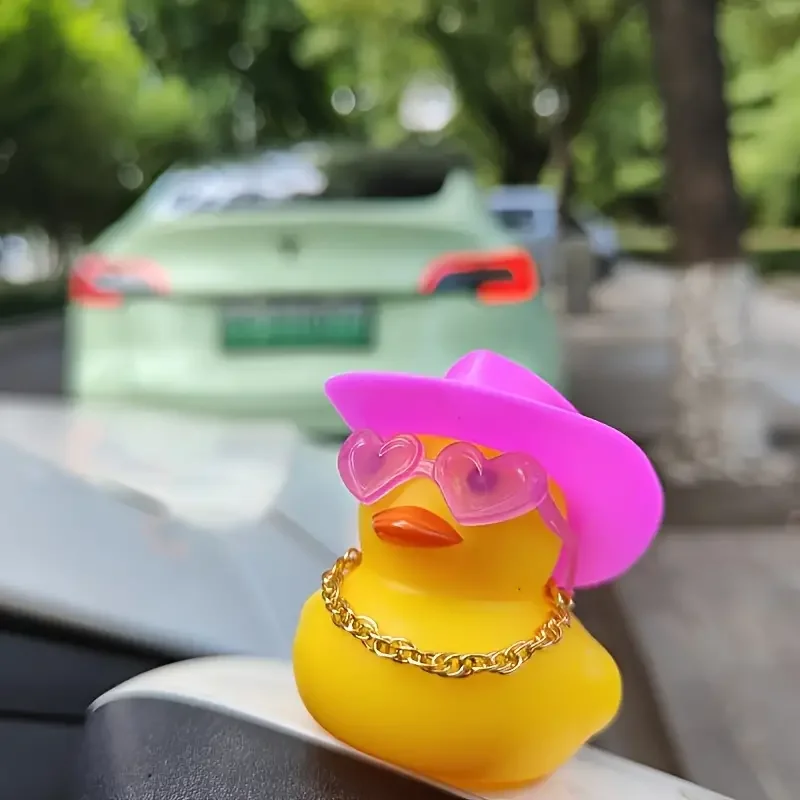 A fashionable rubber duck car dashboard ornament with pink denim hat and heart-shaped glasses decoration accessories