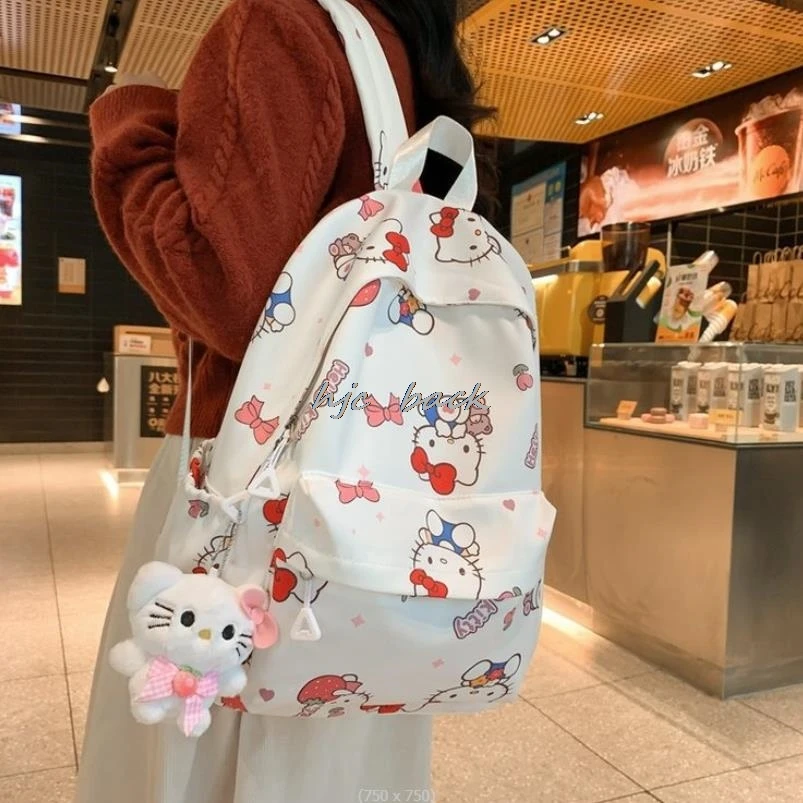 Mochila de Hello Kitty con estampado de dibujos animados para niña, mochila ligera con lazo para estudiantes de escuela media, impermeable, a la moda, regalo para estudiantes