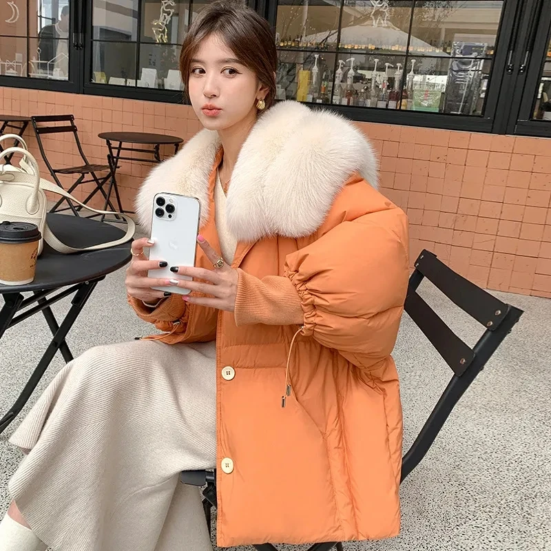 2025 Moda donna elegante pelliccia di volpe artificiale piuma d'anatra bianca nero arancione piumino, cappotti lunghi caldi da donna