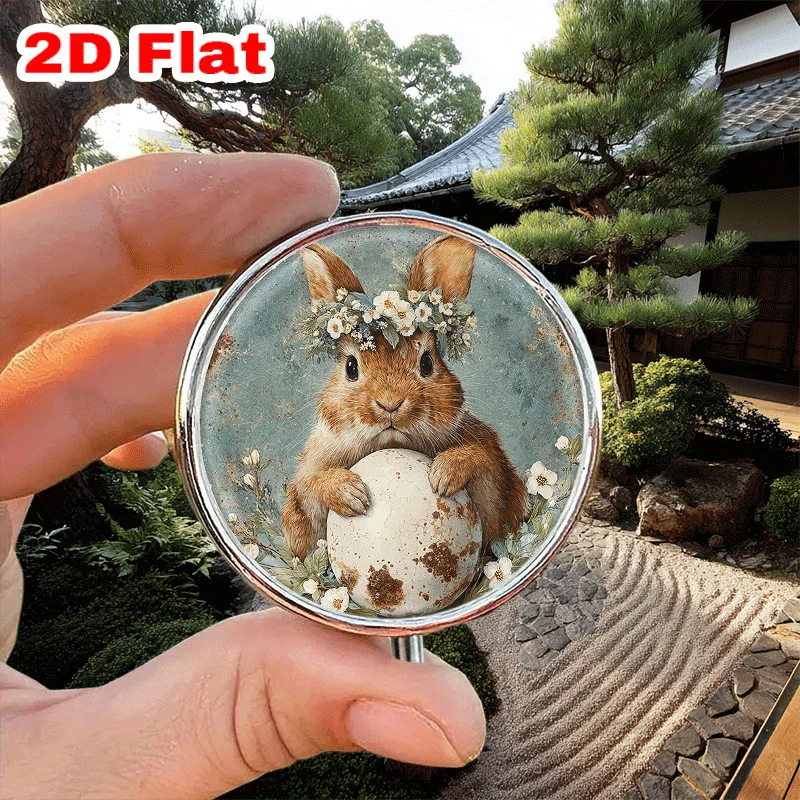 A Single Portable Round Metal Pill Box with Three Compartments, Adorned with a Charming Rabbit and Wreath Design, Is Perfect for Organizing Medication and Adding a Festive Touch for Halloween and Christmas