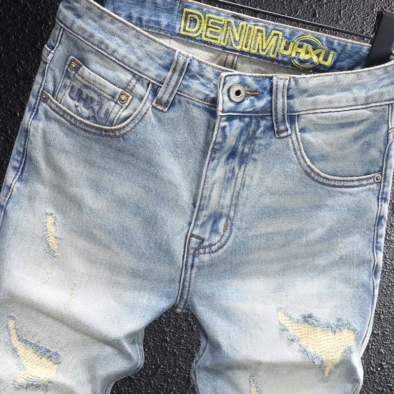 Y2Knew denim jeans, washed with nostalgia, elastic, slim fit, pleated, painted light blue jeans, high street embroidere