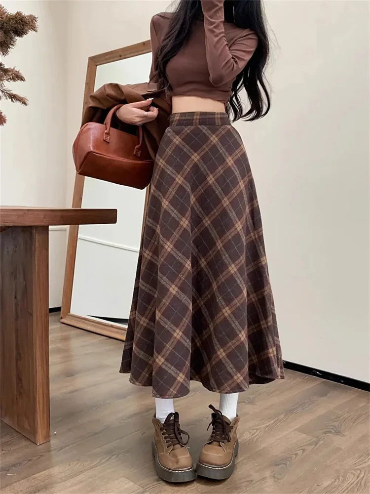 تويد منقوشة عالية الخصر نصف الجسم تنورة الإناث الخريف والشتاء جديد ريترو فضفاض ساحات كبيرة الترفيه طويلة ألف خط نصف الجسم تنورة