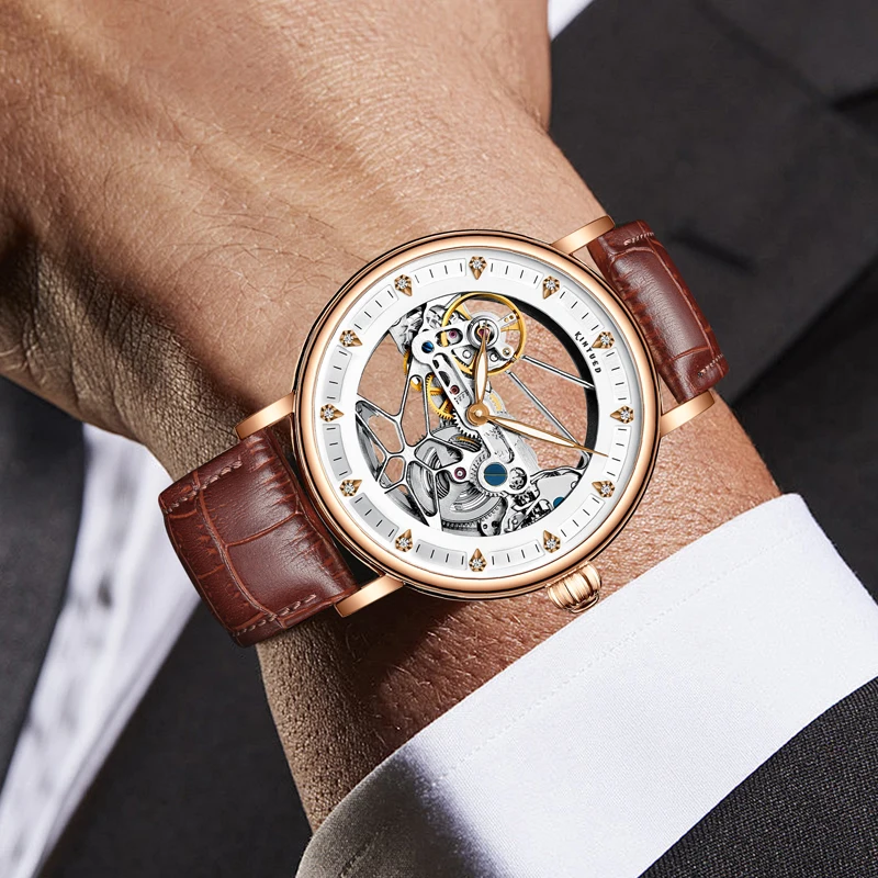 KINYUED العلامة التجارية الجديدة الفاخرة تصميم جوفاء الهيكل العظمي ساعة ميكانيكية للرجال حزام من الجلد مقاوم للماء موضة ساعات أوتوماتيكية رجالي
