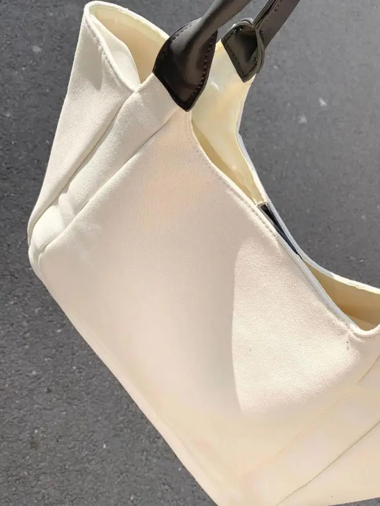 Korean version casual splicing canvas large capacity bag 2023 new minimalist and versatile commuting portable shoulder bag