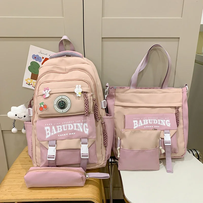 2025 Set di borse da scuola con manico morbido in nylon per la stagione del ritorno a scuola di alta qualità, combinazione di zaini casual con struttura esterna con cerniera solida