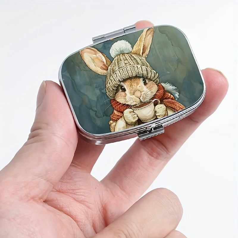 A Square Pill Box with a Winter Rabbit Design, Featuring an Internal Compartment for Storing Medication, a Portable Metal Pill Box Suitable for Placing in Pockets and Handbags, Ideal for Travel and Daily Use, and Makes for a Unique Gift.