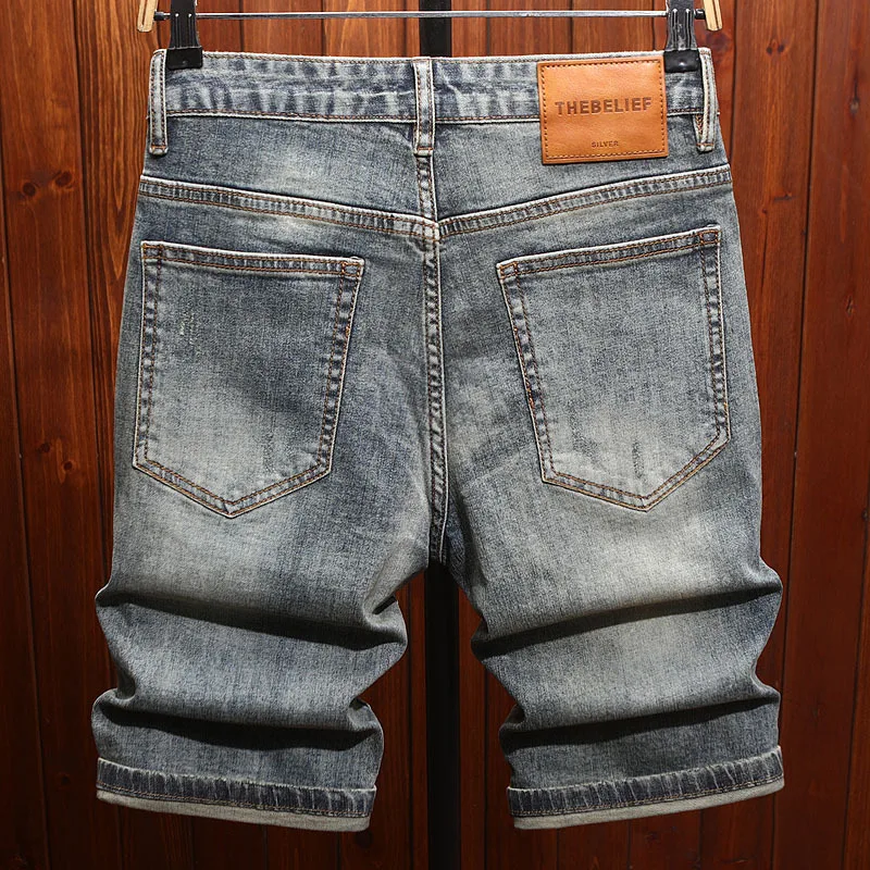 2025 men's clothing, cool and retro, with ripped patches and scraped denim shorts, men's trendy and fashionable cropped pants