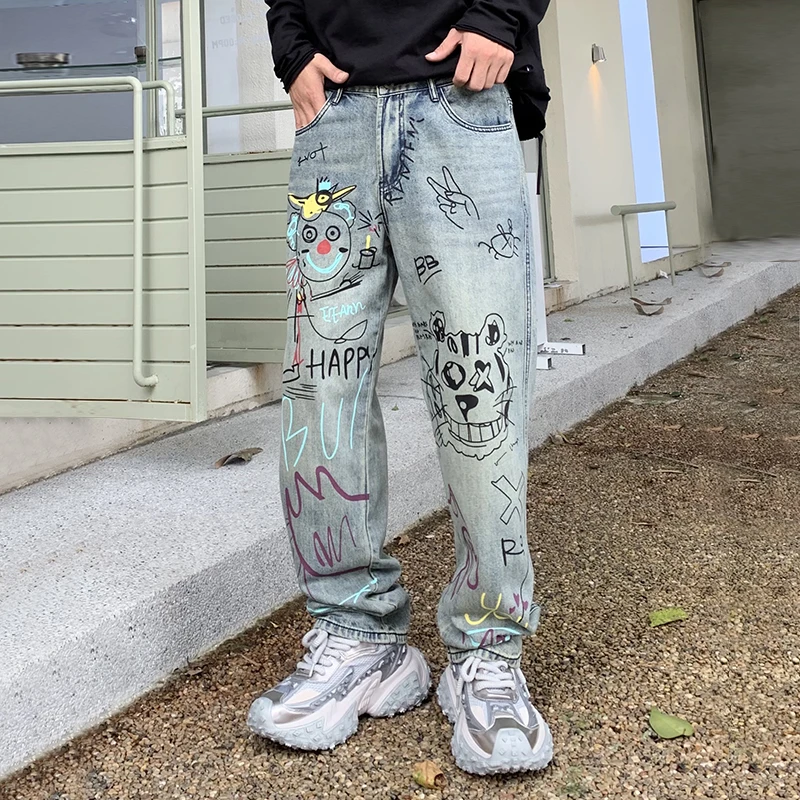 Streetwear jeans grafiti pria, celana kasual peplum kaki lebar lurus longgar populer jalanan Amerika kelas atas