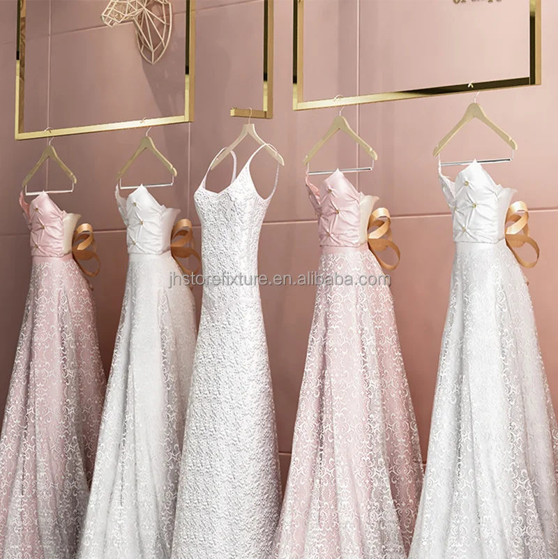 

Custom .Custom.Heavy Gold Wedding Dress Shelf Luxury Wall Mounting Display Rack Decoration Stand for Clothing Store Boutiques