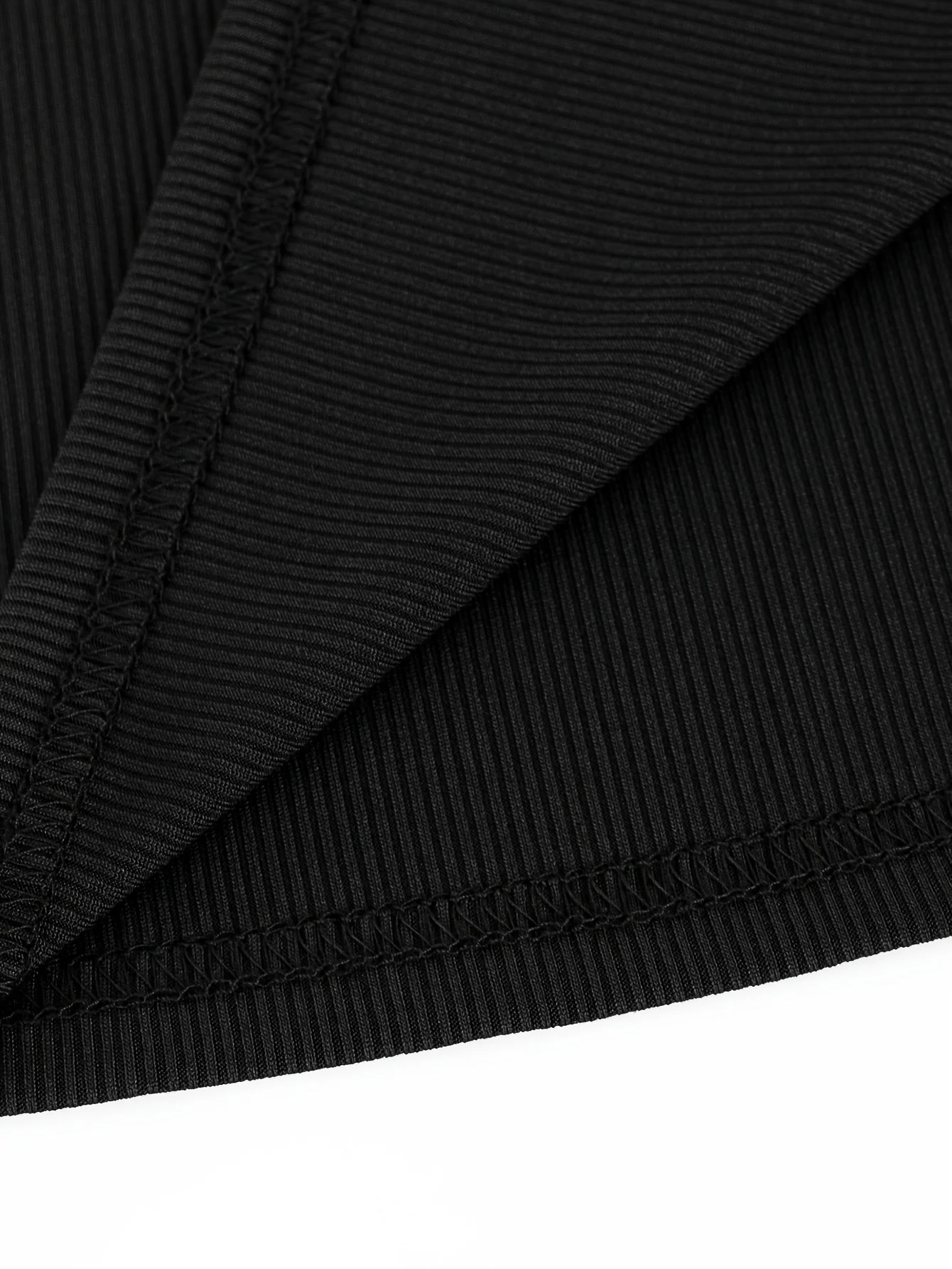 بلوزة نسائية بأكمام طويلة ومضلعة باللون الأسود مع تفاصيل غير متماثلة - ملابس أنيقة ومثيرة #6