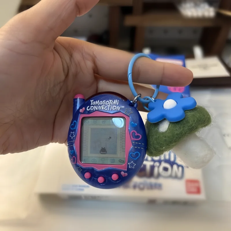 

In Stock 2025 New Version Of Electronic Pets Game Cartoon Cute Can Be Linked And Used To Collect Holiday Gifts To Send Friends