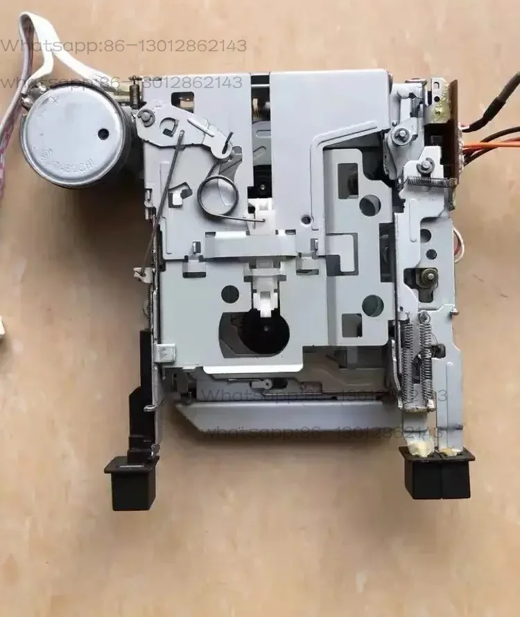 Light gray car tape recorder with self-winding mechanism, tape recorder mechanism accessories, back and forth