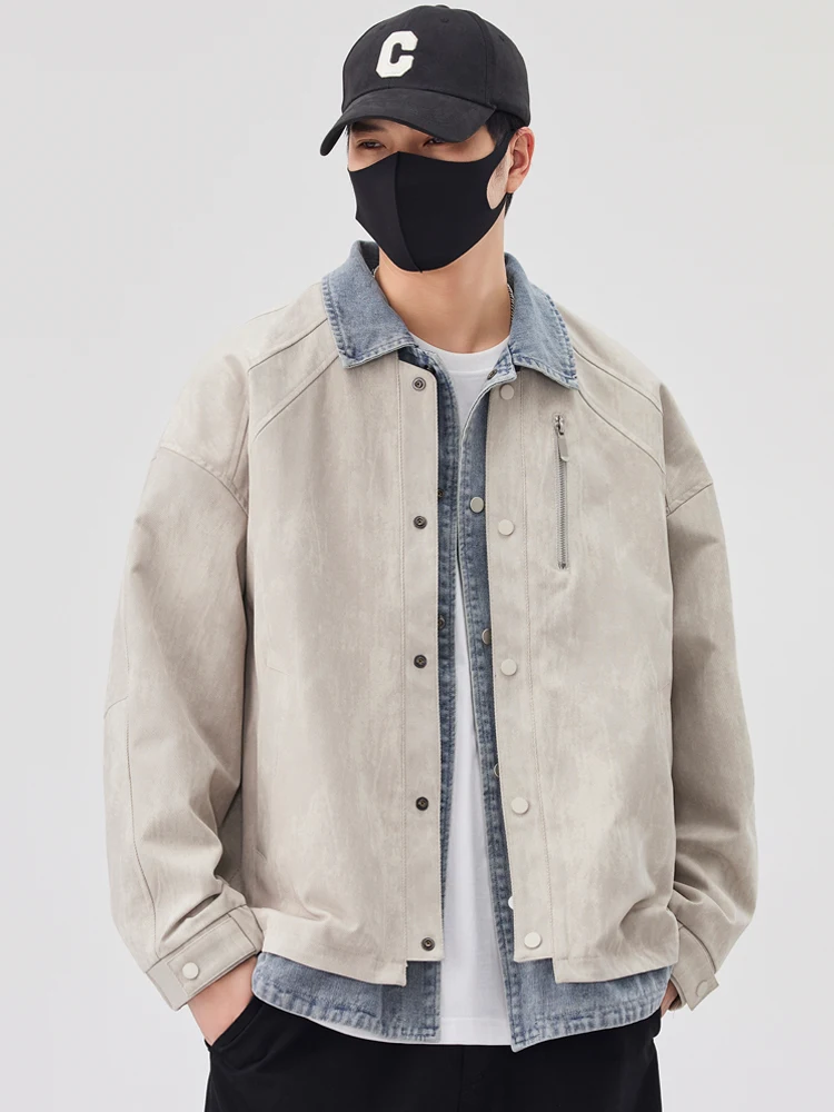 2025 primavera y otoño nueva chaqueta vaquera de dos piezas falsa de color blanco roto chaqueta negra informal versátil de moda para hombres