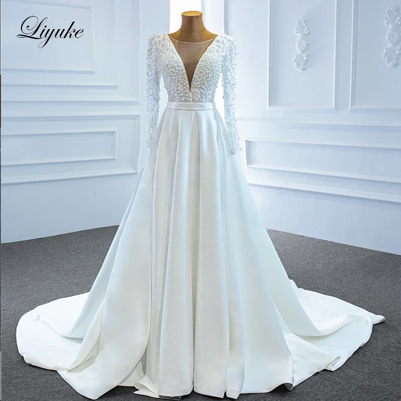 

Liyuke Exquisite Pearls Long Sleeve A Line Wedding Dress Split With Deep V Neck Beads Corset Bridal Gown