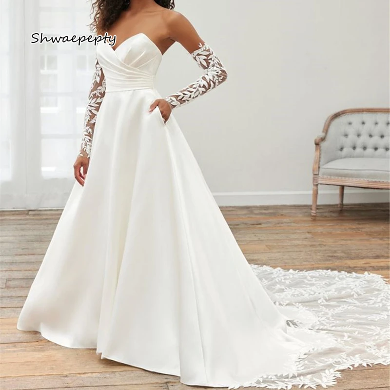 クラシックレースアップリケ A ラインウェディングドレス ポケット付き ストラップレス 恋人ネックライン サテン ブライダルガウン バックボタン カスタマイズ