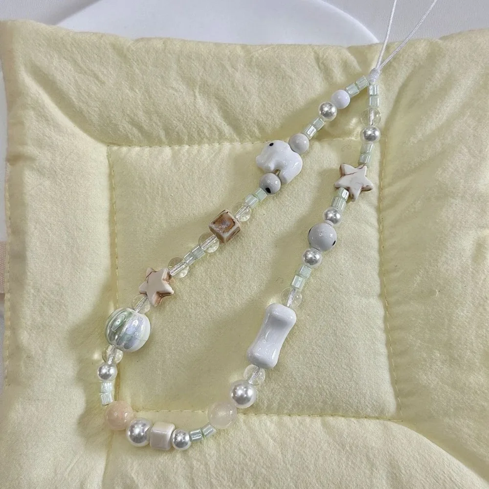 The Cute Milk White Set along with Elephant Beaded Phone Chain, Polaroid CCD Hanging Rope, Safety Rope, Handheld