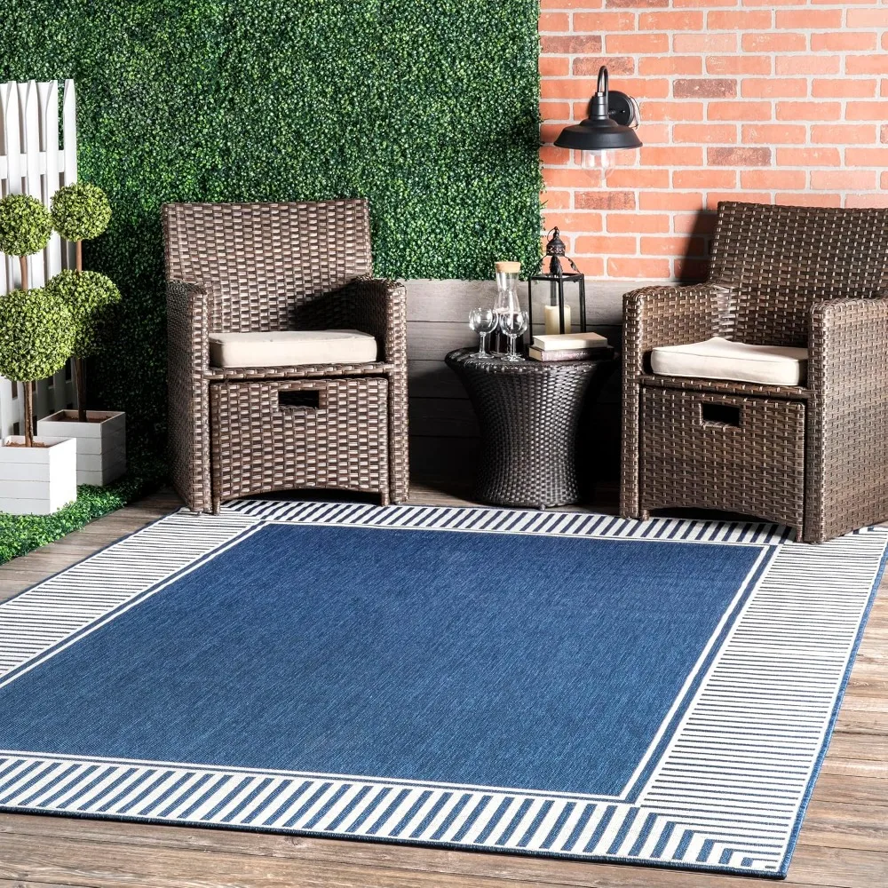 5' x 8' outdoor area rug with striped border in a casual design that is stain resistant and highly durable