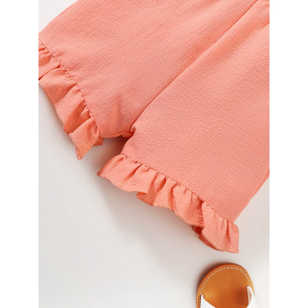 Nowy 2024 dziecięcy kombinezon dziewczęcy na lato szelki zwykły kolor trzepoczące rękawy marszczone krawędzie body ubrania imprezowe dla dziewczynki 4-7 lat