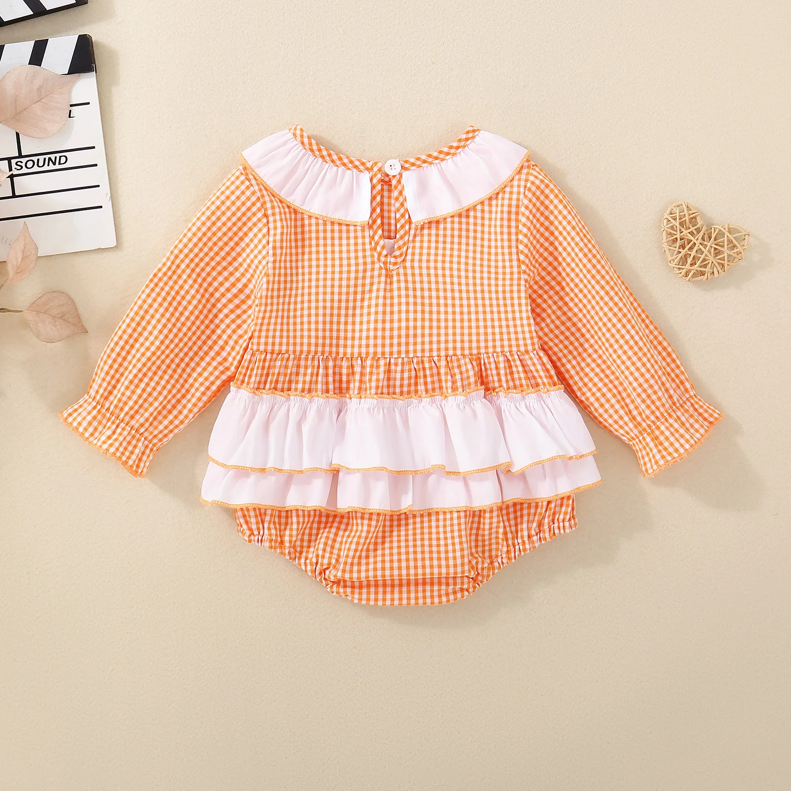 Spring/Autumn long-sleeved knitted bodysuit for baby girls, featuring orange rugby ball embroidery