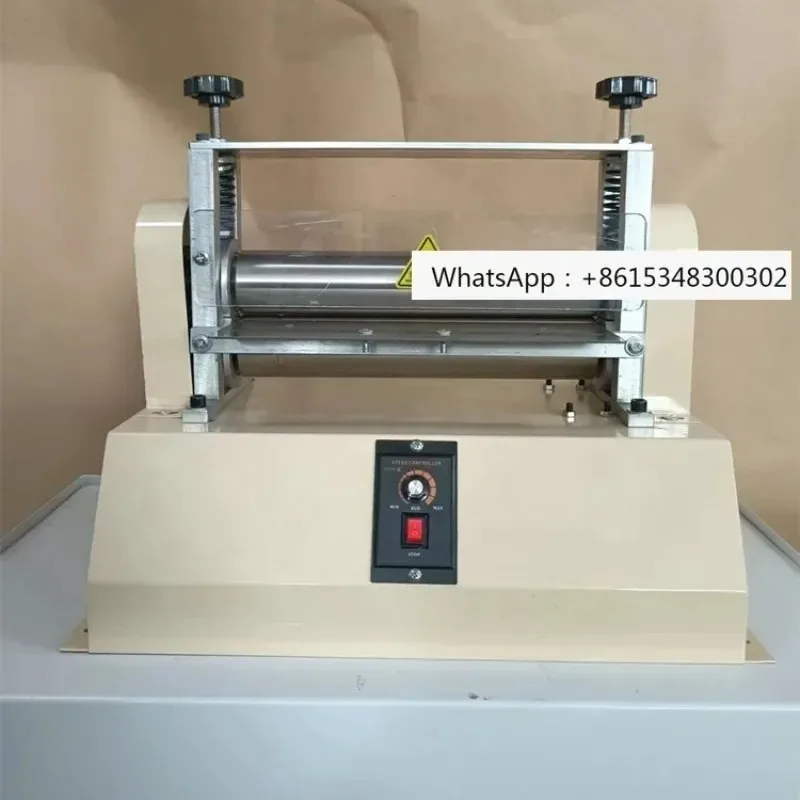 Leather shoulder strip adhesive roller folding machine